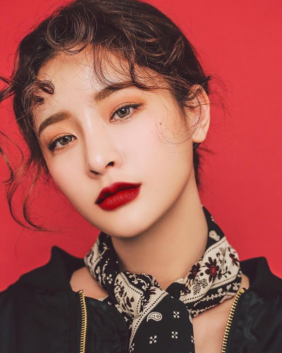 woman wearing bold dark red lipstick