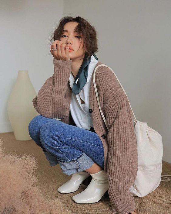 Asian woman wearing a cardigan