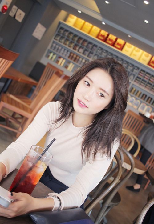 asian woman with a short shag haircut