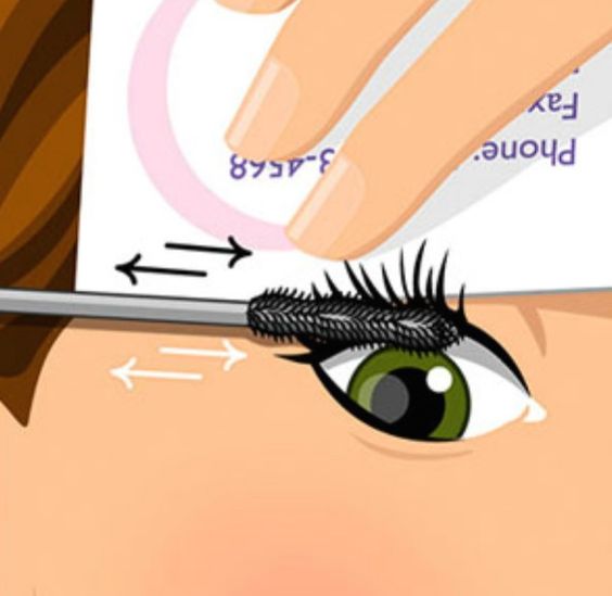 Applying mascara with card as shield