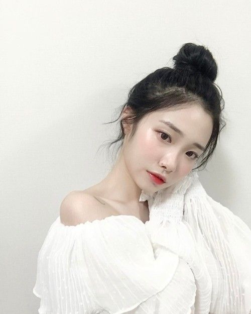 asian girl with hair in a bun