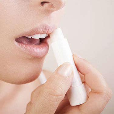 Applying lip balm