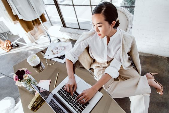 how to deal with anger in the office workplace asian lady wearing all white workwear outfit