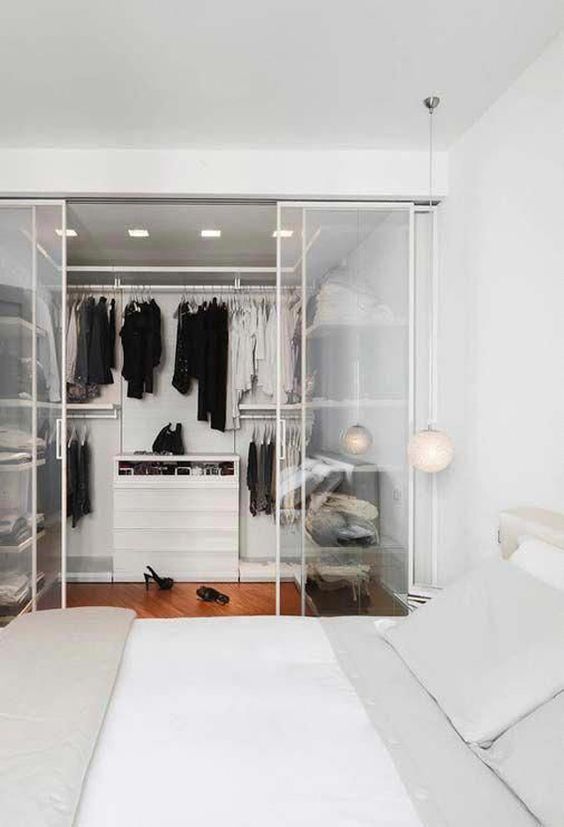 white minimalist Walk-In Wardrobe In A Small HDB bto Flat room with glass partition with black matte frames