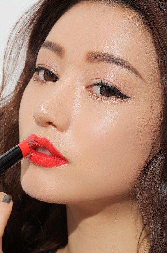 asian woman with coral lipstick To Get Fairer & Brighter Skin: