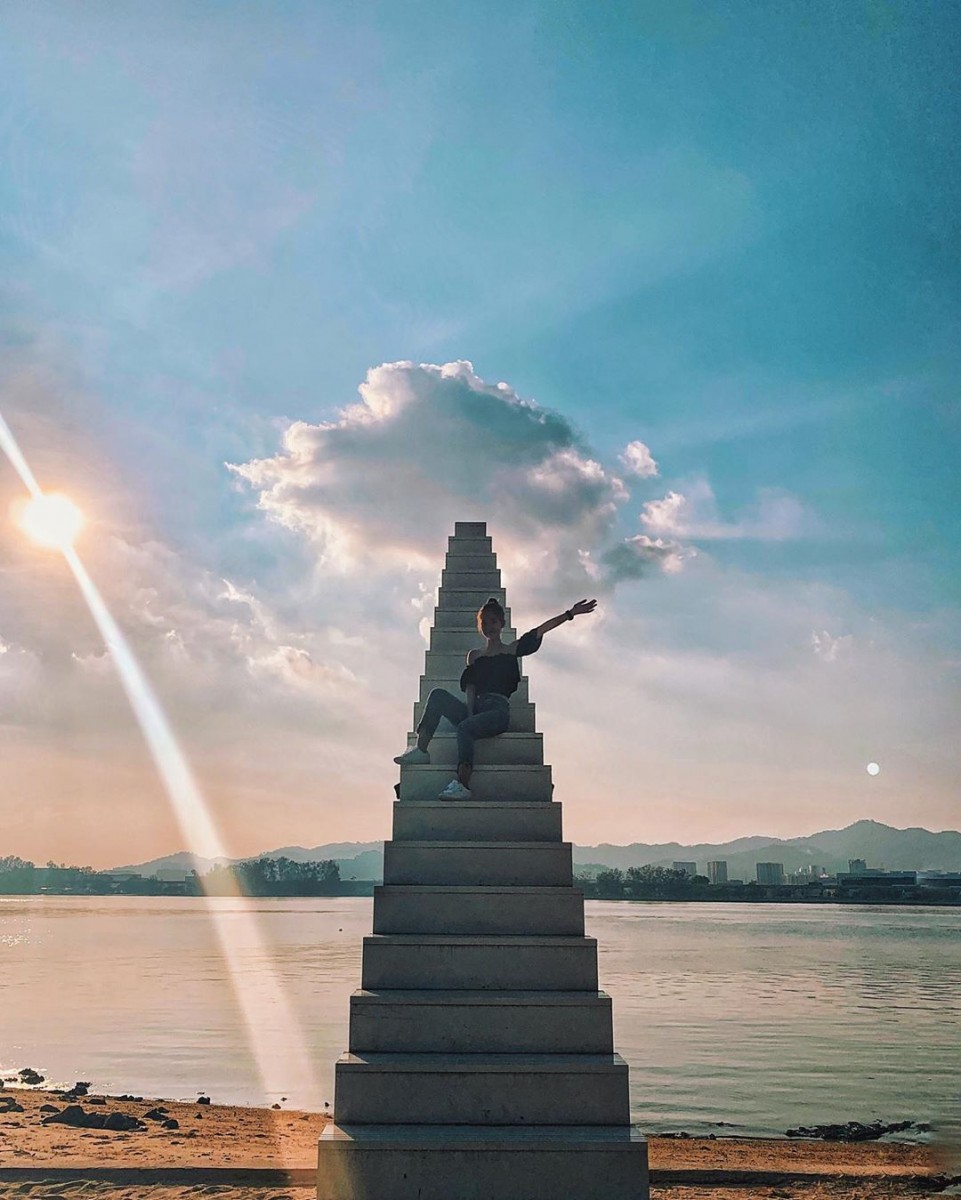Girl sitting on stairway to heaven in Penang