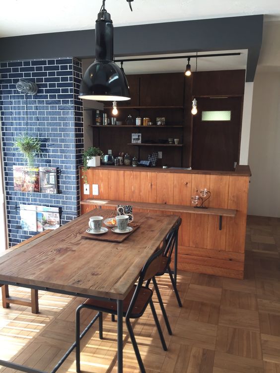 open-concept kitchen singapore small HDB flat bto home renovation cosy industrial interior design with wood, subway tiles and black walls