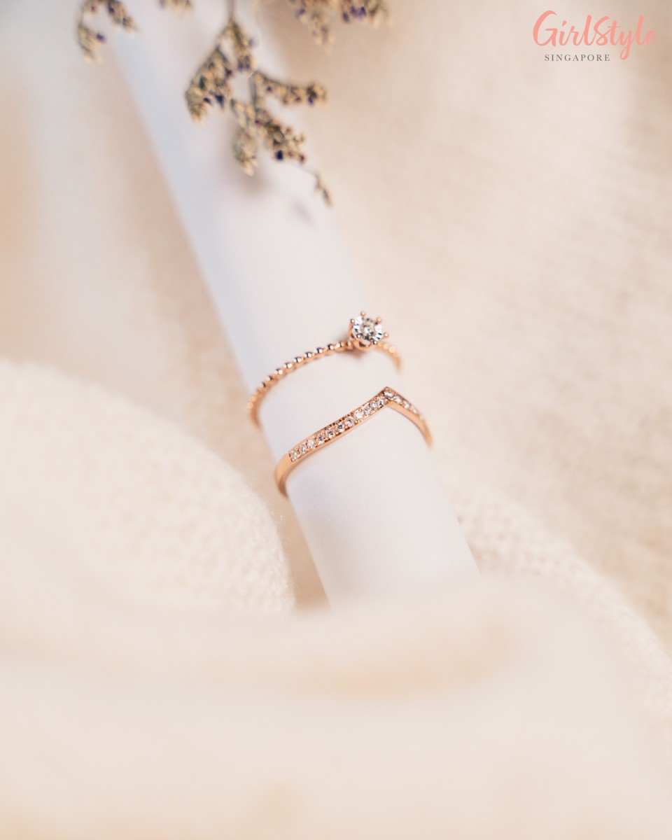 Two rose gold rings worn together