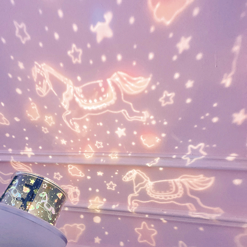 Starry night light projection lamp in pink with unicorns