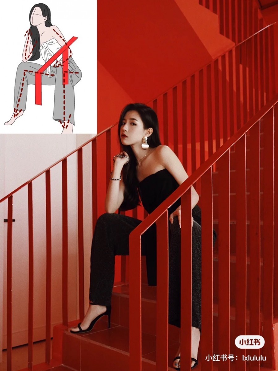 Girl sitting down on stairs with hand under her chin