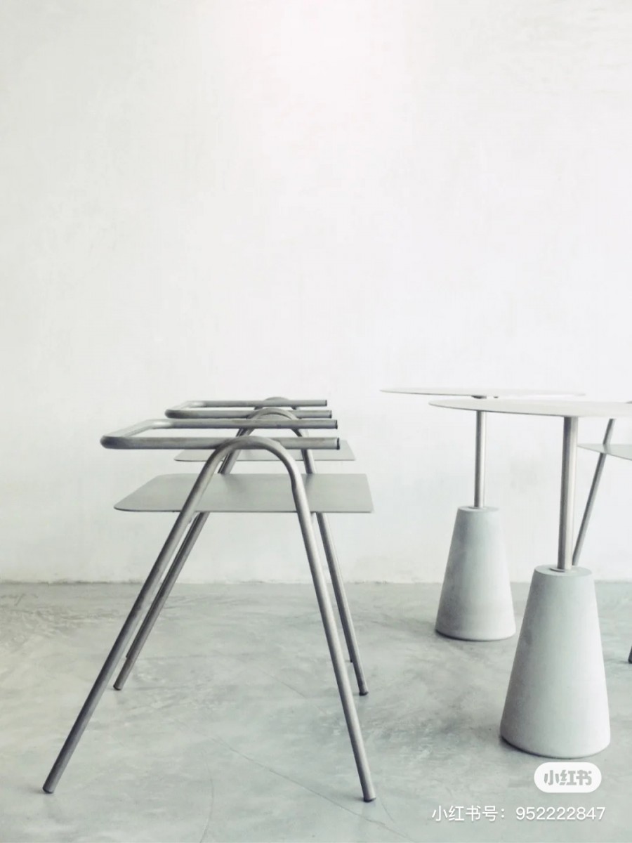 Grey chairs and tables in Lucid cafe