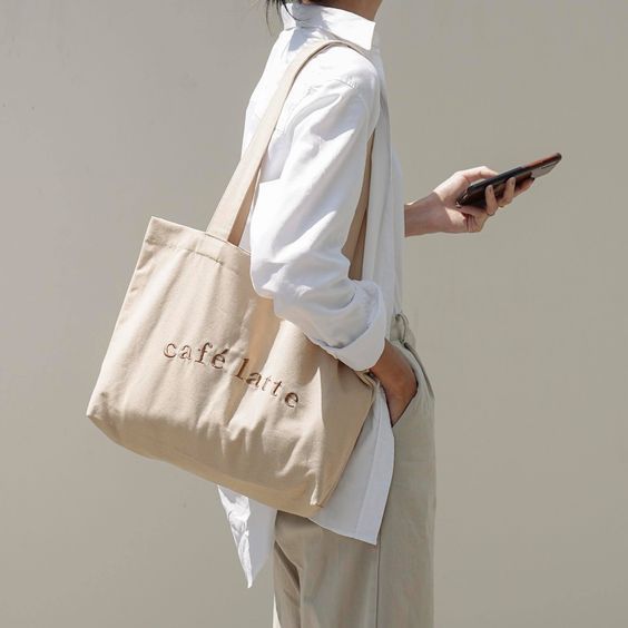 Girl using a brown tote bag