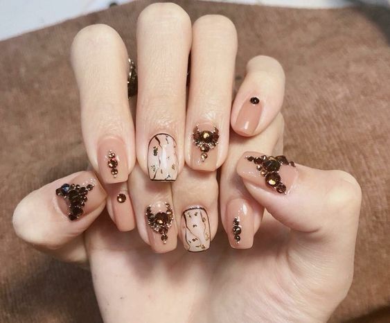 glamorous Bridal Nail Art with black embellishments