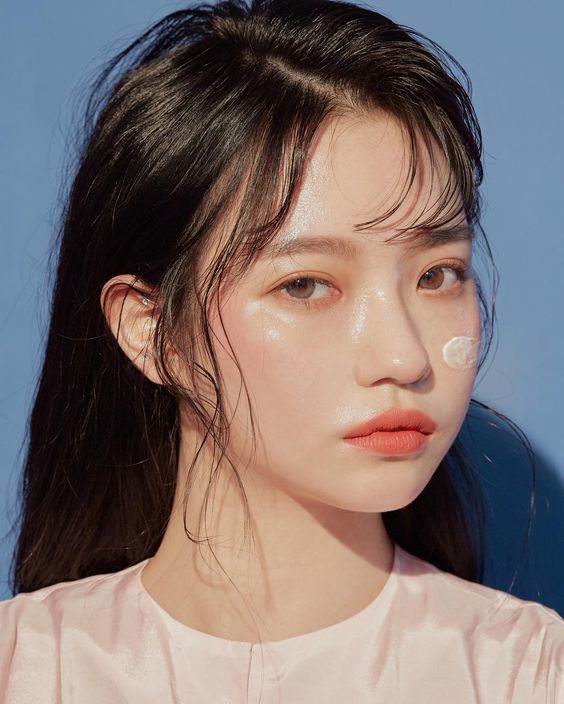 asian woman using moisturiser as a makeup primer To Get Fairer & Brighter Skin: