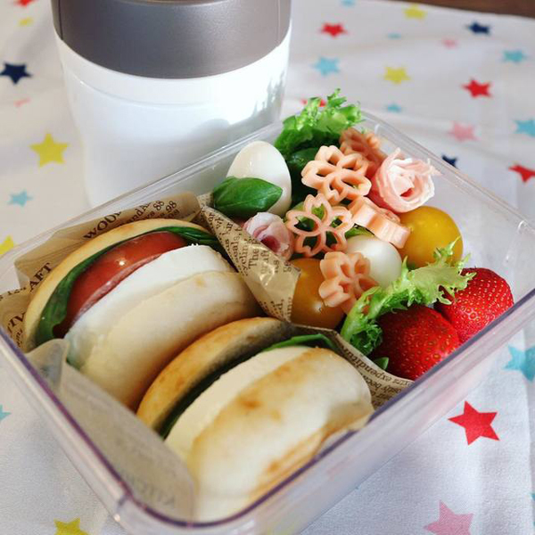 sakura-shaped pasta as topping for bento box lunch salad