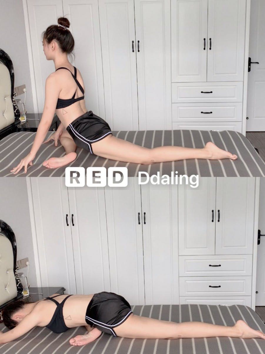 asian woman doing leg stretch on a bed