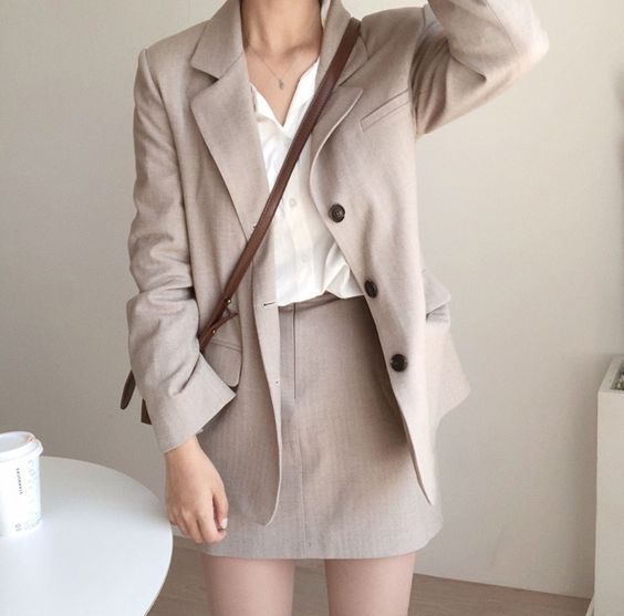 White collared shirt and beige blazer