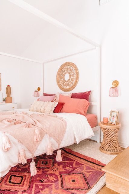 bedroom with pink pillows and blanket