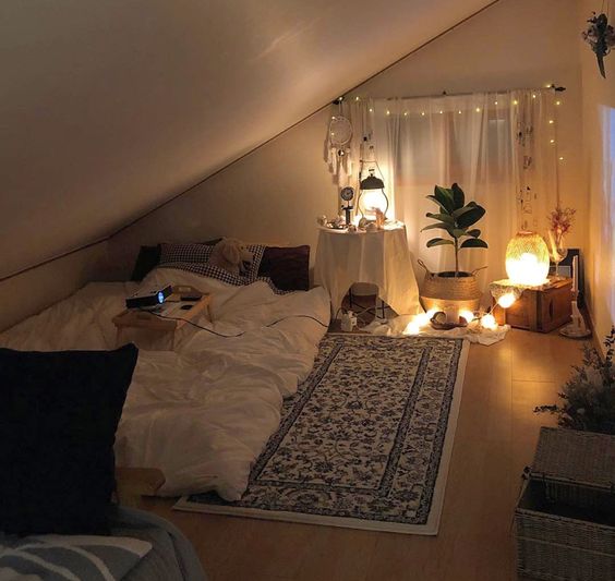 rooftop attic bedroom with slanted wall and candles