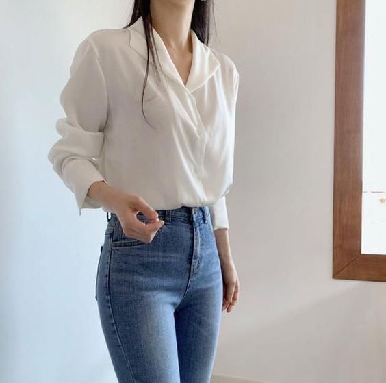 Silk white collared shirt with tucked in skinny jeans