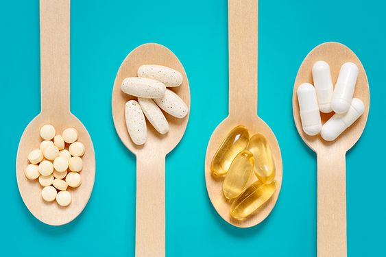 Different types of supplements on spoons