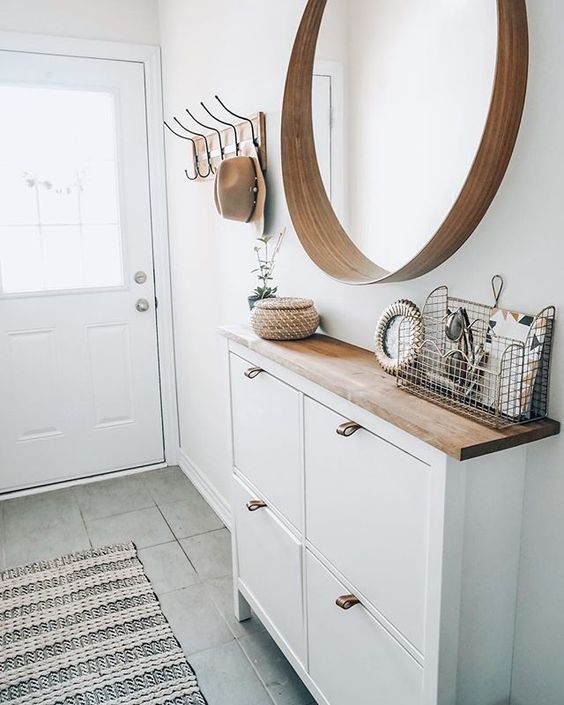 small entryway white Narrow, floating shoe cabinets and a round mirror