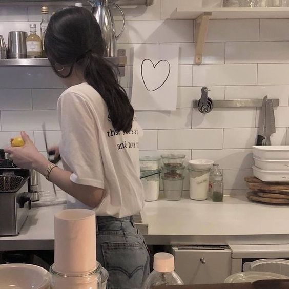 asian girl spring cleaning kitchen