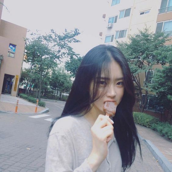 Girl eating ice cream on the streets