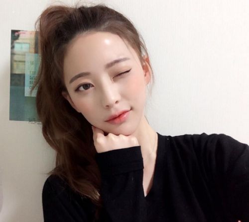 Girl taking selfie with light makeup on