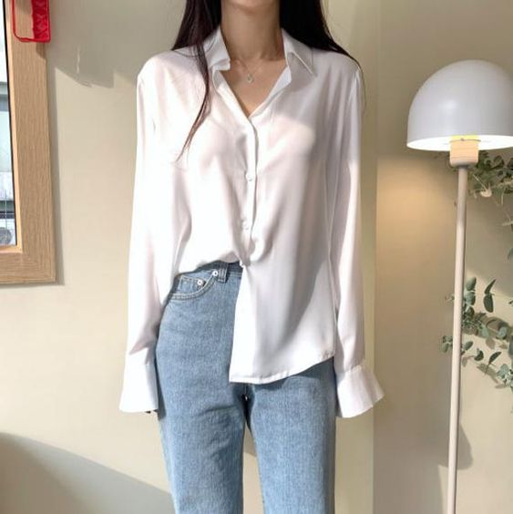 White collared shirt with one side tucked out