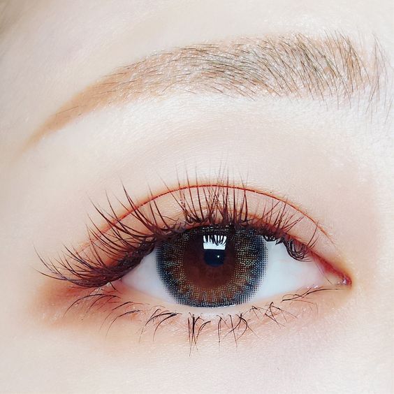 asian woman's eye with long lashes and natural eyeshadow colour