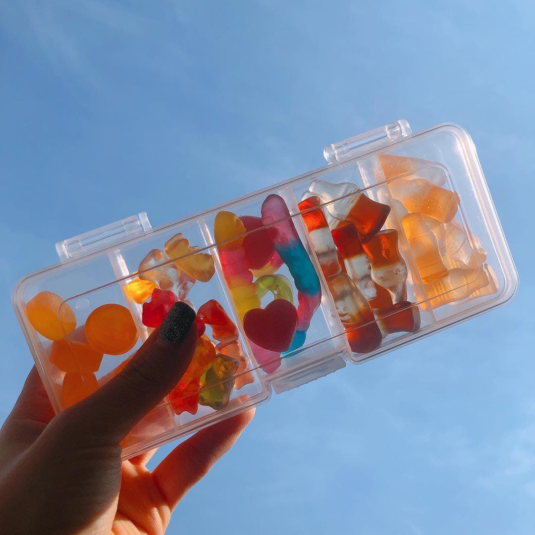 Gummy bento box held against the sky