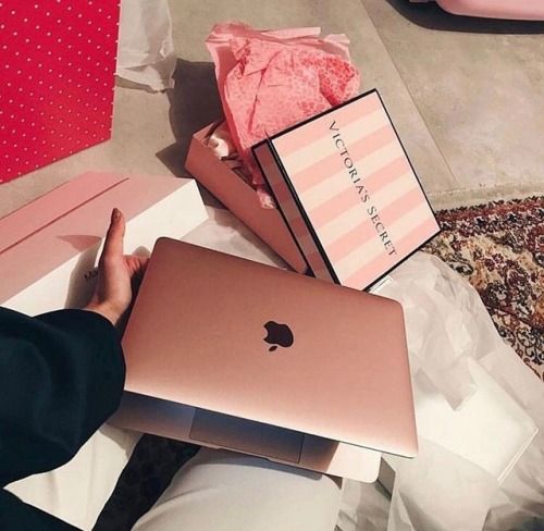 Macbook with Victoria Secret online shopping bags