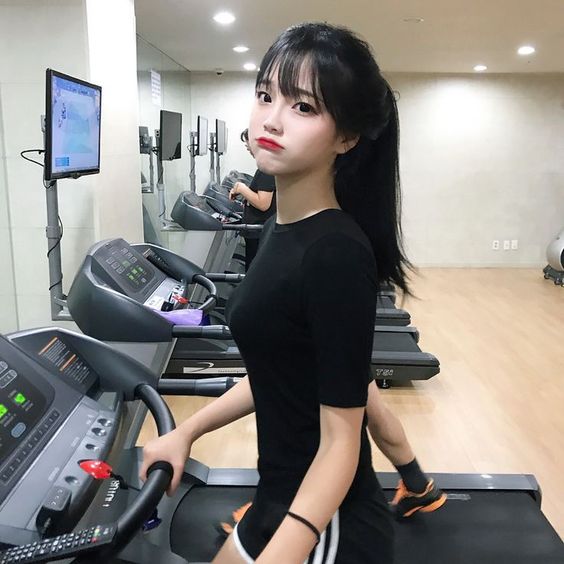 Girl exercising on a treadmill