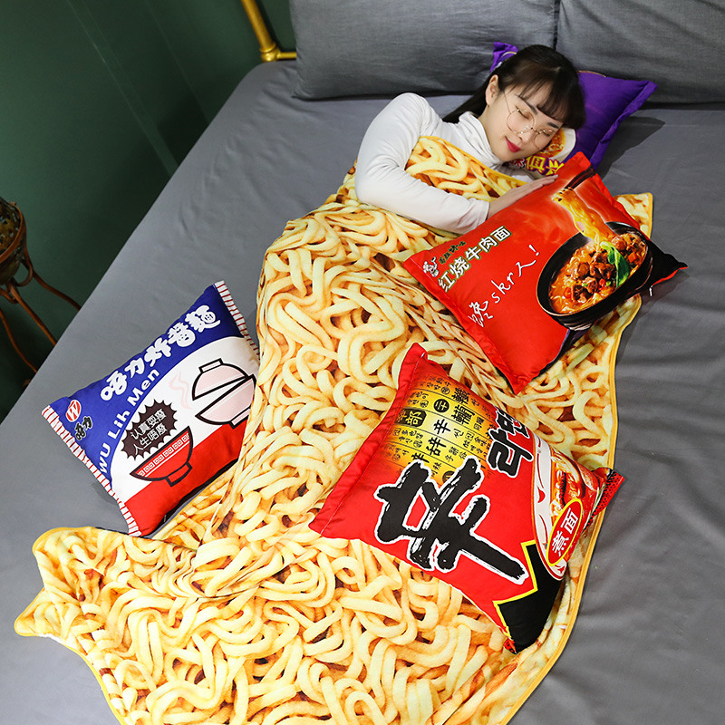 asian girl lying in bed under a Instant noodle ramen blanket