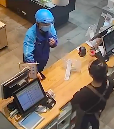 delivery man in china checking with the cashier
