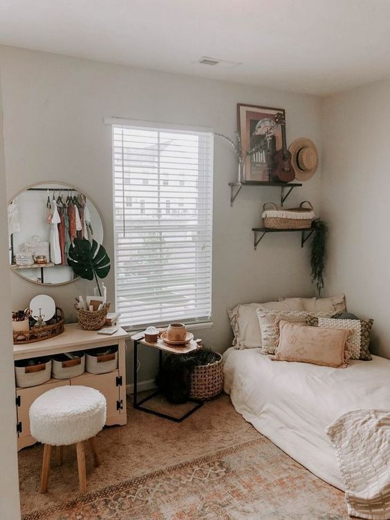 small bedroom with a dresser vanity and rug
