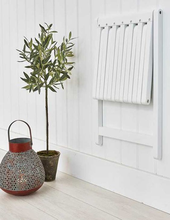 chair that can be collapsed and folded against the wall