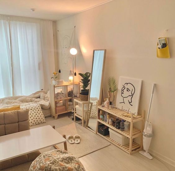 minimalist korean-style bedroom with sheer curtains, low bed and leaning mirror