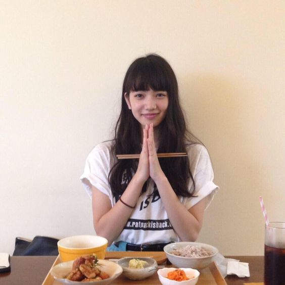 Girl eating food at the dining table