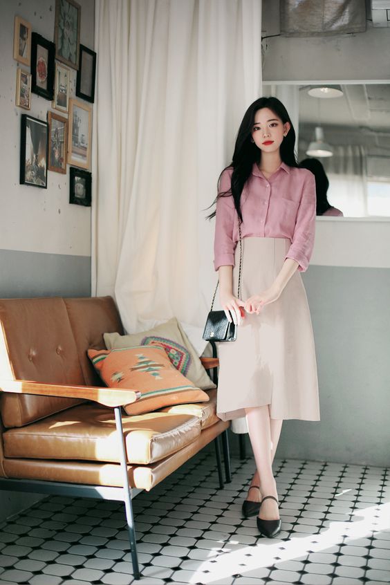 Pink collared shirt and beige midi skirt