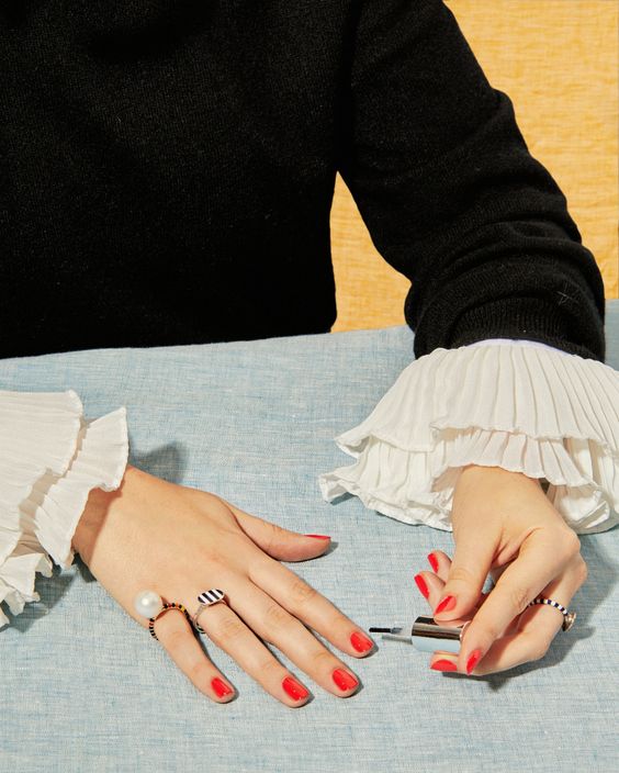 Girl painting her own nails