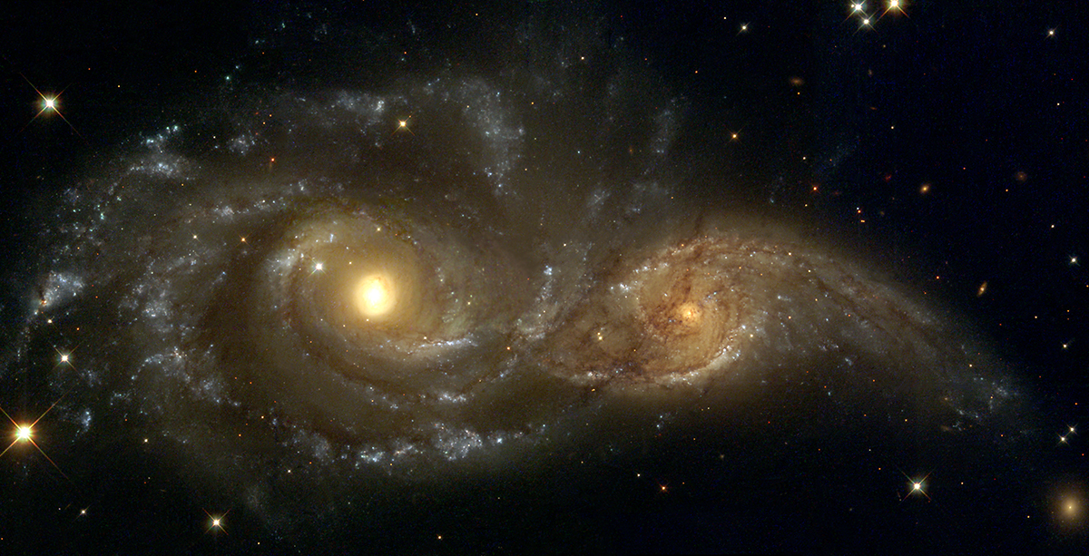 NASA galaxy photo with two golden orbs 