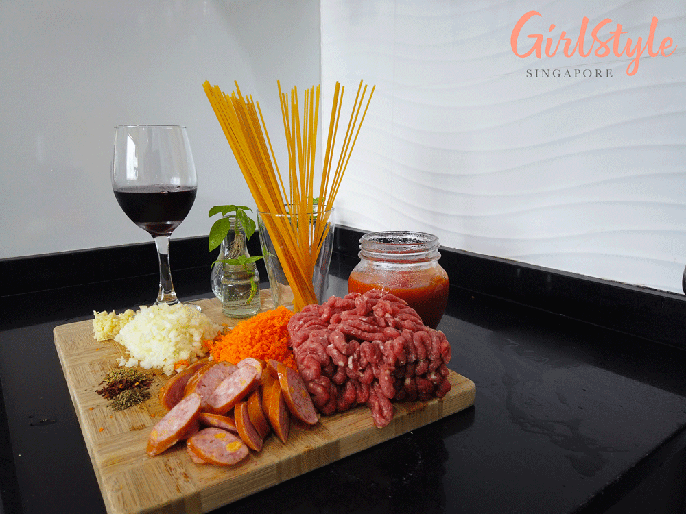 ingredients for homemade Spaghetti bolognese pasta with beef and sausages, garlic and onions