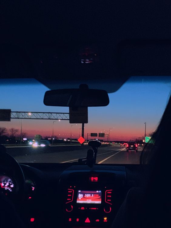Driving the car with the sun setting