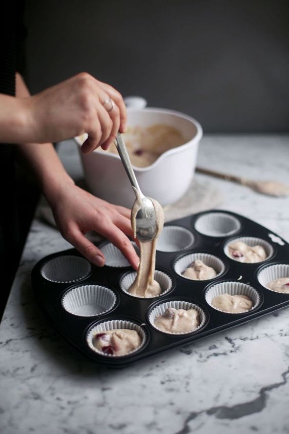Putting batter into muffin trays