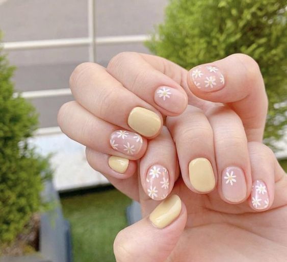 Pastel yellow floral nail design