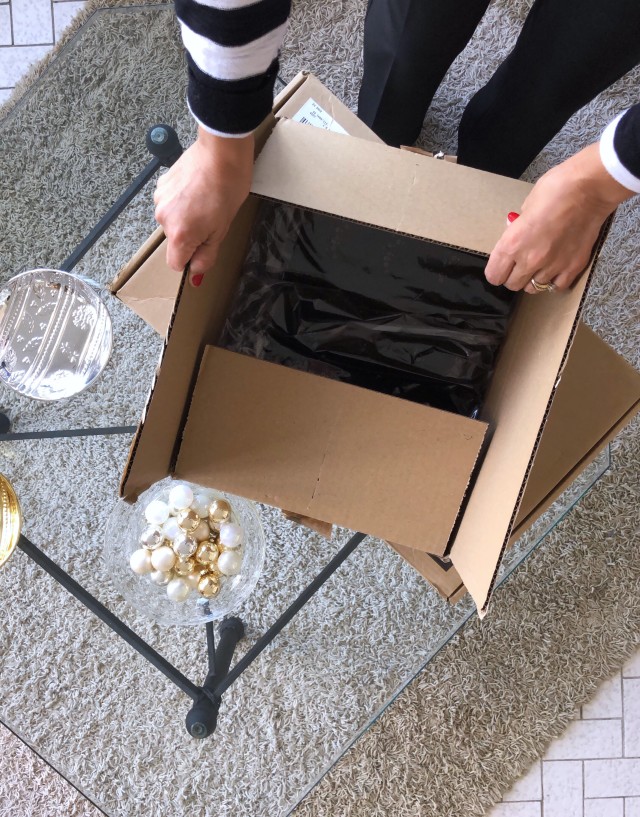 opening a box package on a table