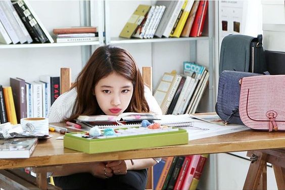 korean girl with chin on table
