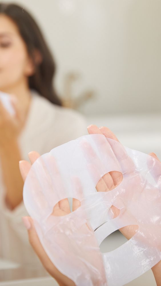 Girl holding a sheet mask